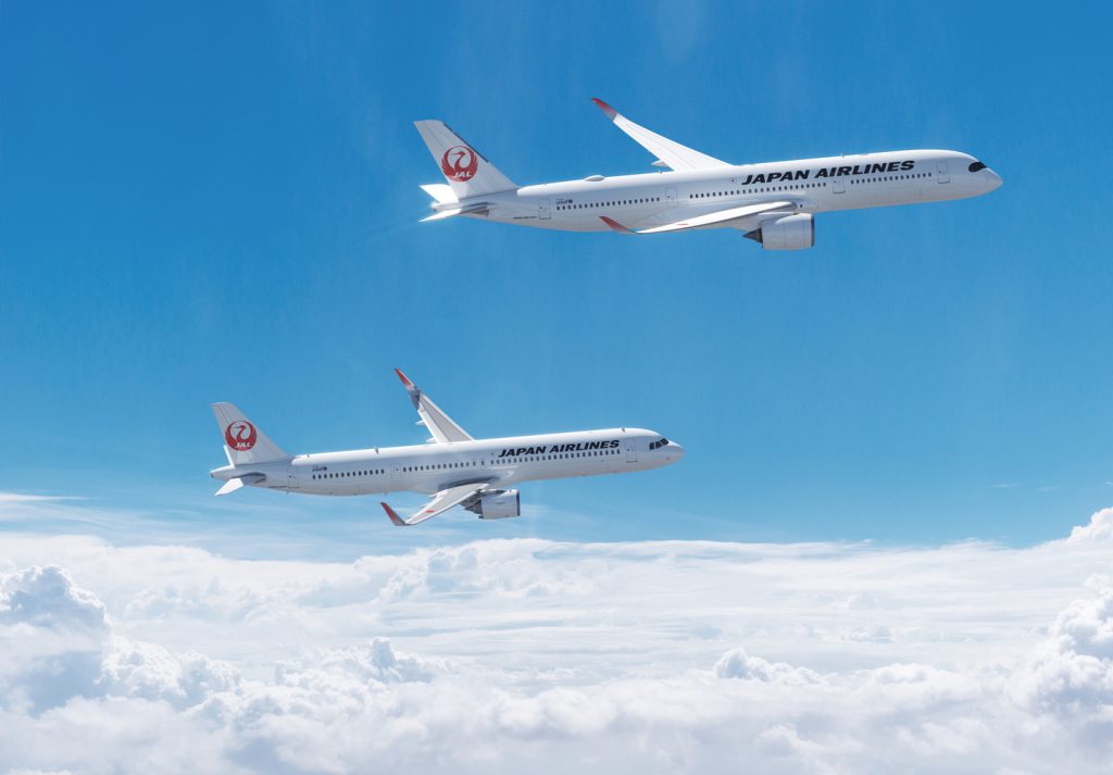 A digital rendering of two Japan Airlines aircraft flying in the air